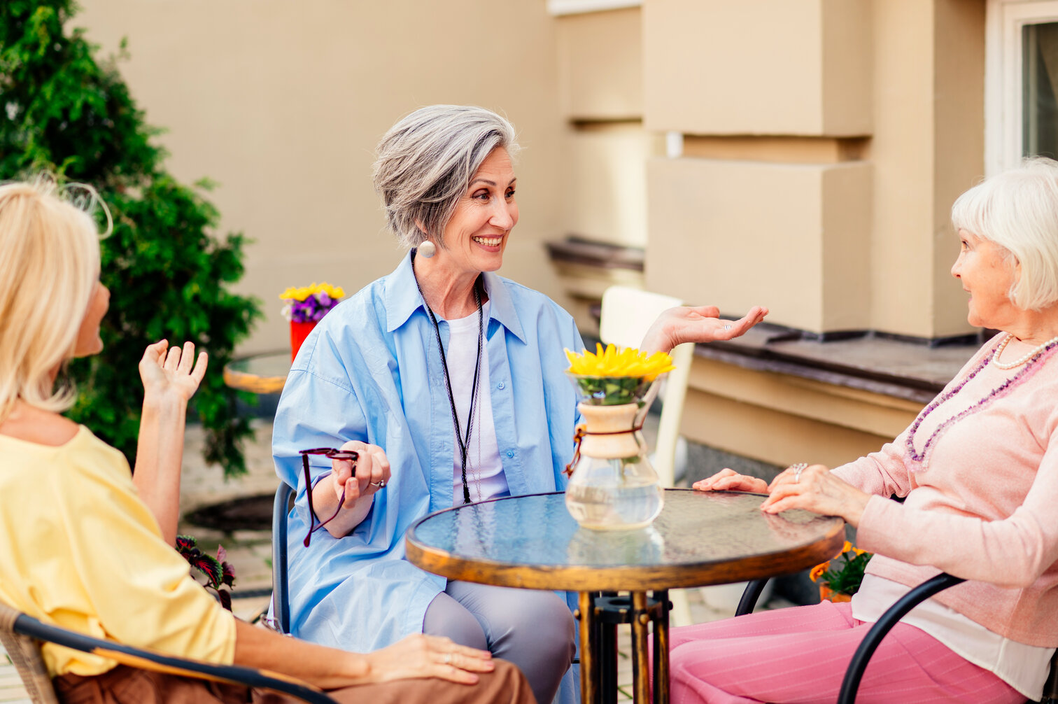 Women bonding outdoors in senior assisted living in Fresno.