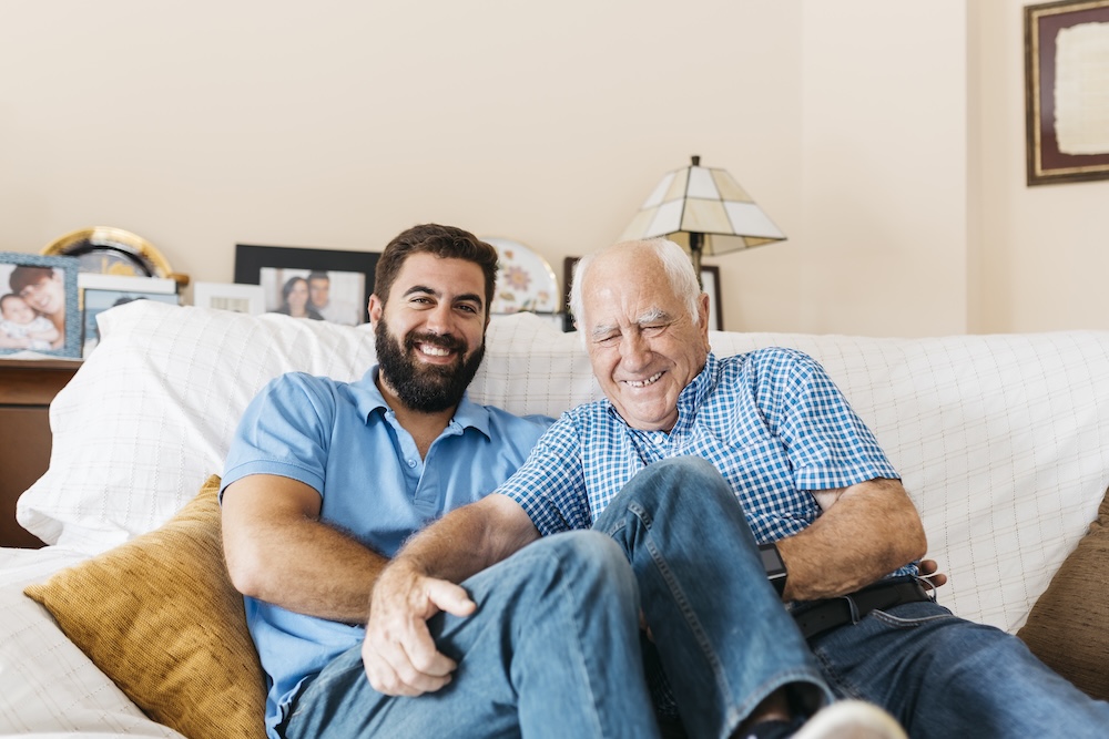 Elderly father and adult son enjoying their time together now that he's receiving alzheimers care fresno ca